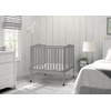 image:imageDelta Children Folding Portable Mini Baby Crib with 15inch Mattress  Greenguard Gold Certified WhiteGrey