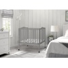image:imageDelta Children Folding Portable Mini Baby Crib with 15inch Mattress  Greenguard Gold Certified WhiteGrey