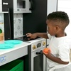 image:imageDelta Children Gourmet AllinOne Corner Play Kitchen  Toy Kitchen Playset with Safe amp Heatless Stove with Lights Oven Sink FridgeFreezer with Ice Maker and 20 Accessories NaturalWhiteGrey