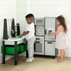 image:imageDelta Children Gourmet AllinOne Corner Play Kitchen  Toy Kitchen Playset with Safe amp Heatless Stove with Lights Oven Sink FridgeFreezer with Ice Maker and 20 Accessories NaturalWhiteGrey