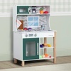 image:imageDelta Children Gourmet AllinOne Corner Play Kitchen  Toy Kitchen Playset with Safe amp Heatless Stove with Lights Oven Sink FridgeFreezer with Ice Maker and 20 Accessories NaturalWhiteGreen