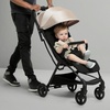 image:imageJeep Altitude Compact Travel Stroller by Delta Children Greenguard Gold Easy One Hand Fold Lightweight Extendable Canopy with PeekaBoo Window Reclining Seat 4 Wheel Suspension TanTan