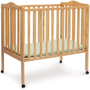 image:imageDelta Children Folding Portable Mini Baby Crib with 15inch Mattress  Greenguard Gold Certified WhiteNatural